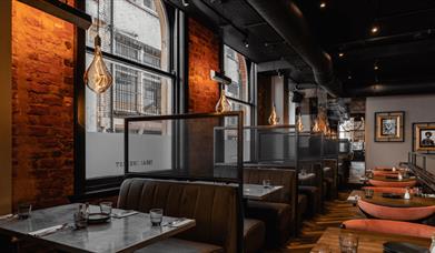A booth seating area with lights.