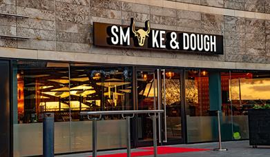 Stone exterior of Smoke & Dough on the terrace at Liverpool ONE